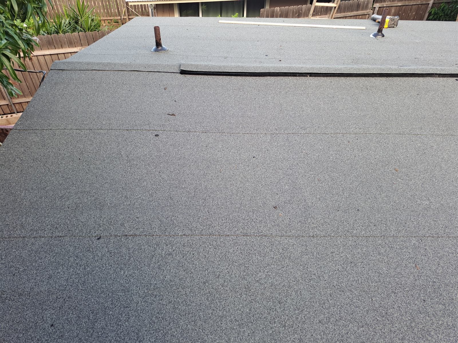 Newly installed low-slope roof with overlapping seams