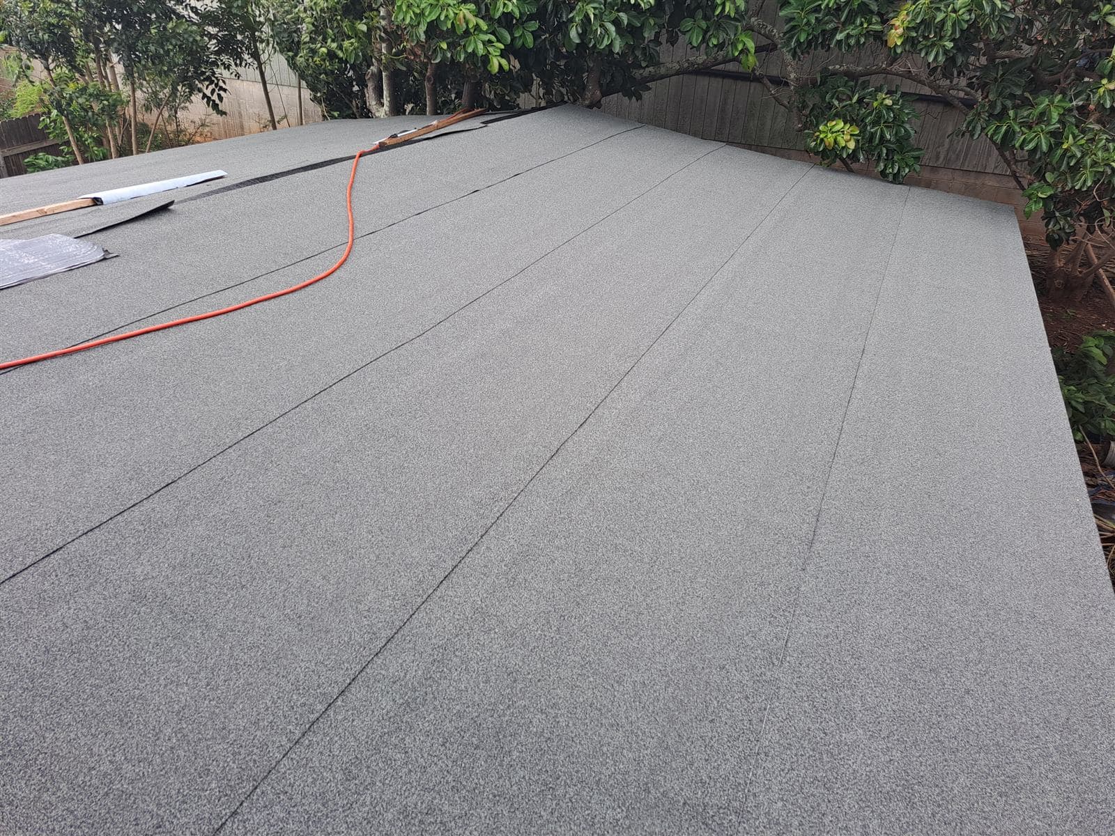 New granulated roll roofing installed on a low-slope roof