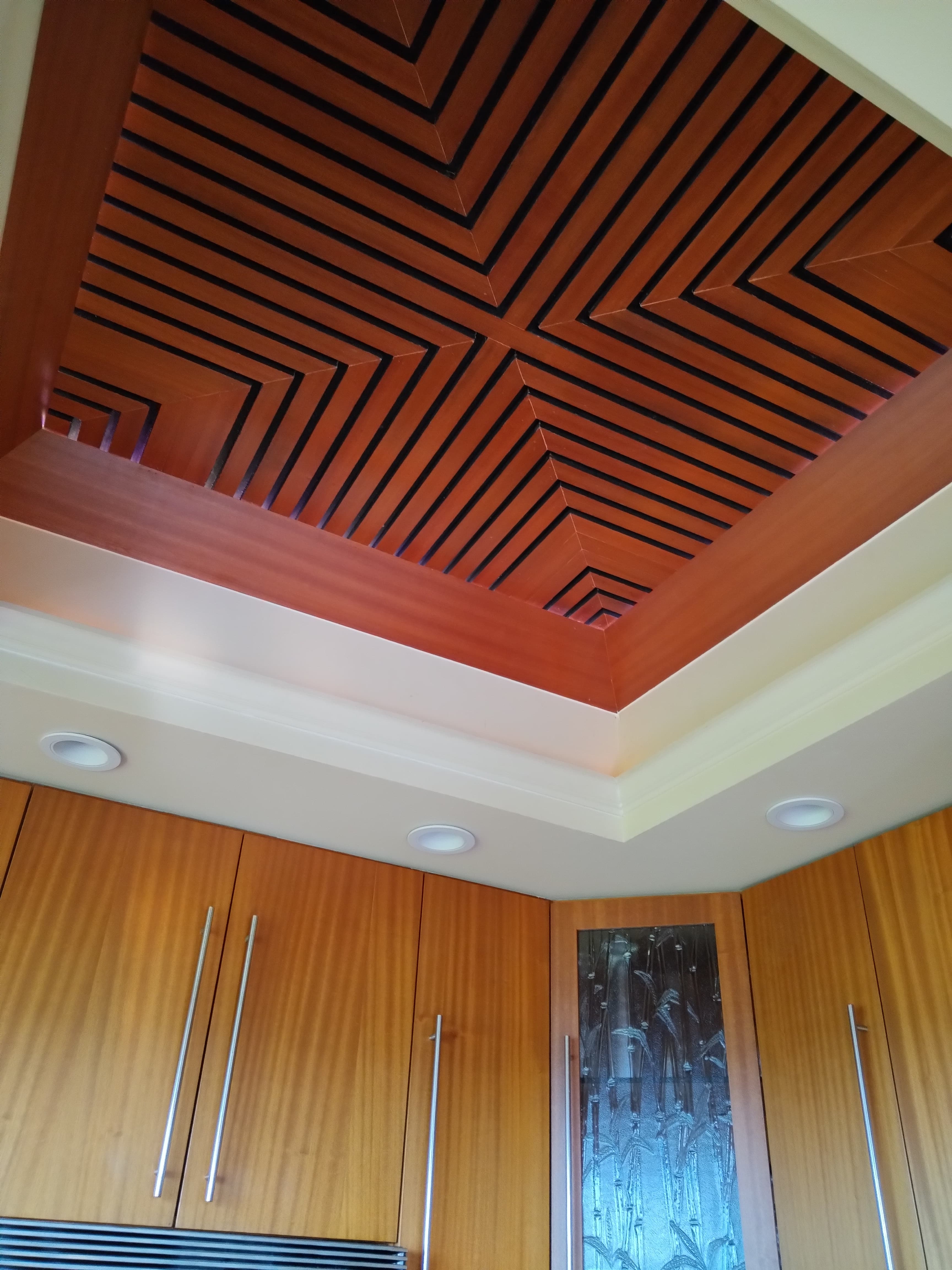 Custom wooden ceiling and kitchen cabinetry by Aaron's Custom Carpentry