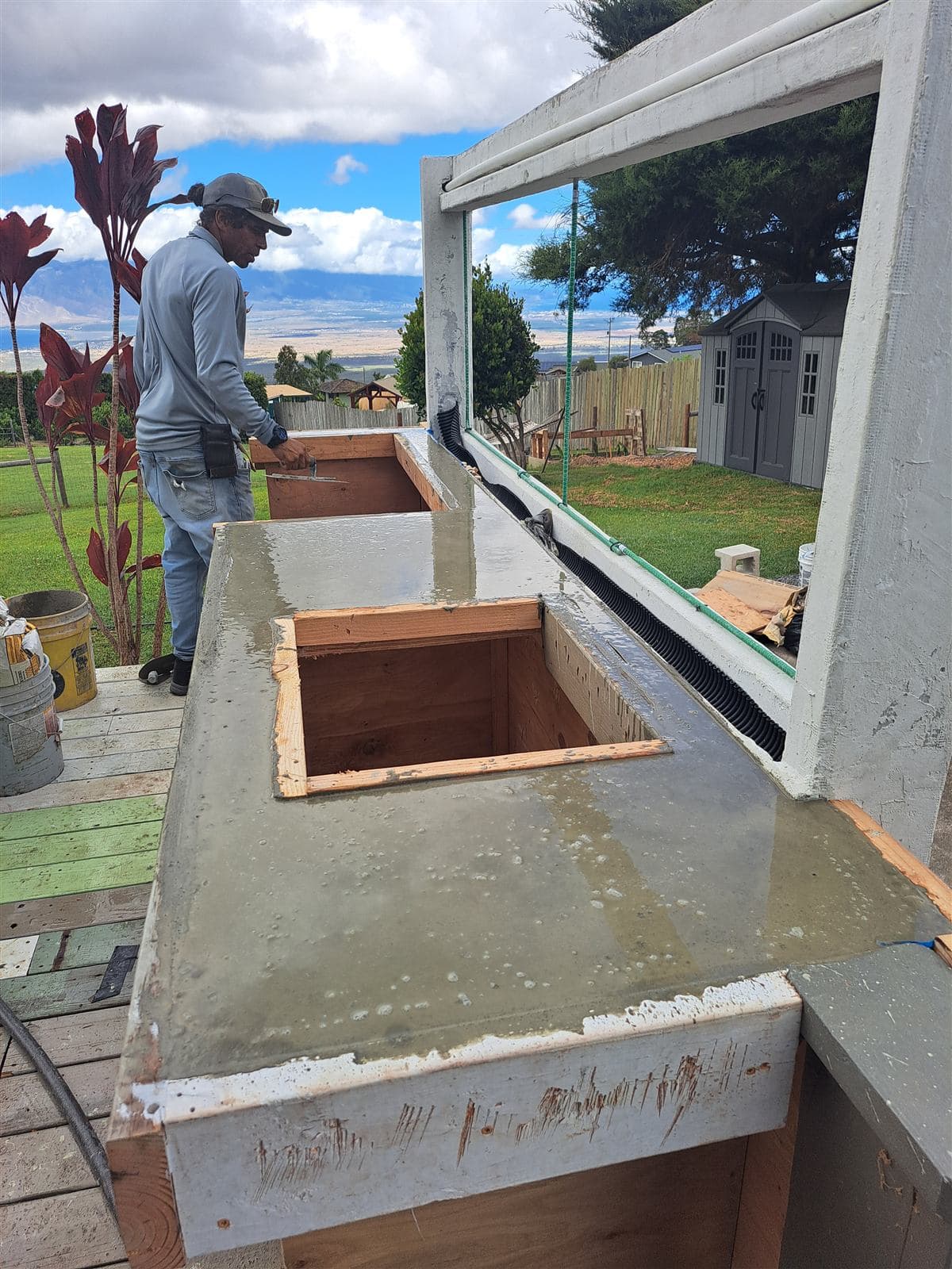Concrete outdoor bar counter being built on a deck