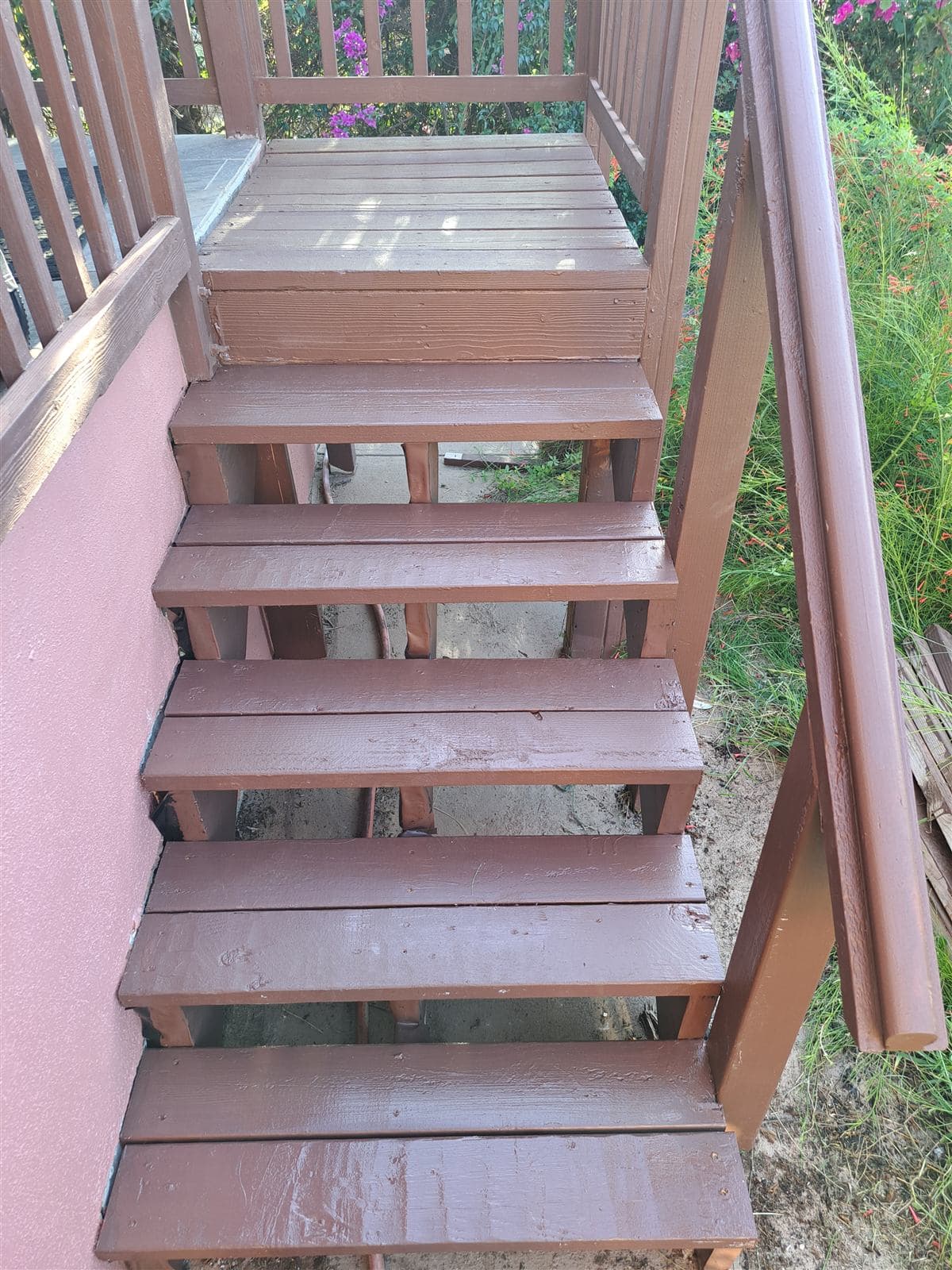 Rebuilt exterior wood stairs with new treads and stain